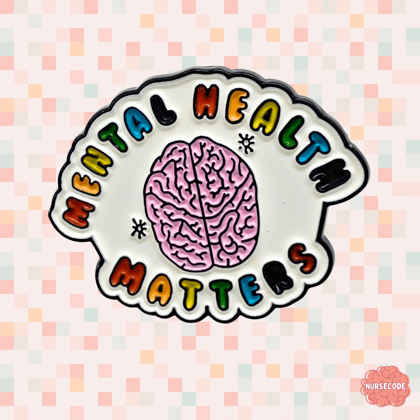 multi coloured pin with mental health matters with sketch of a brain